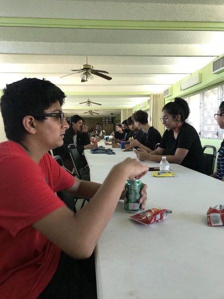 Group of teenage boys eating snacks
